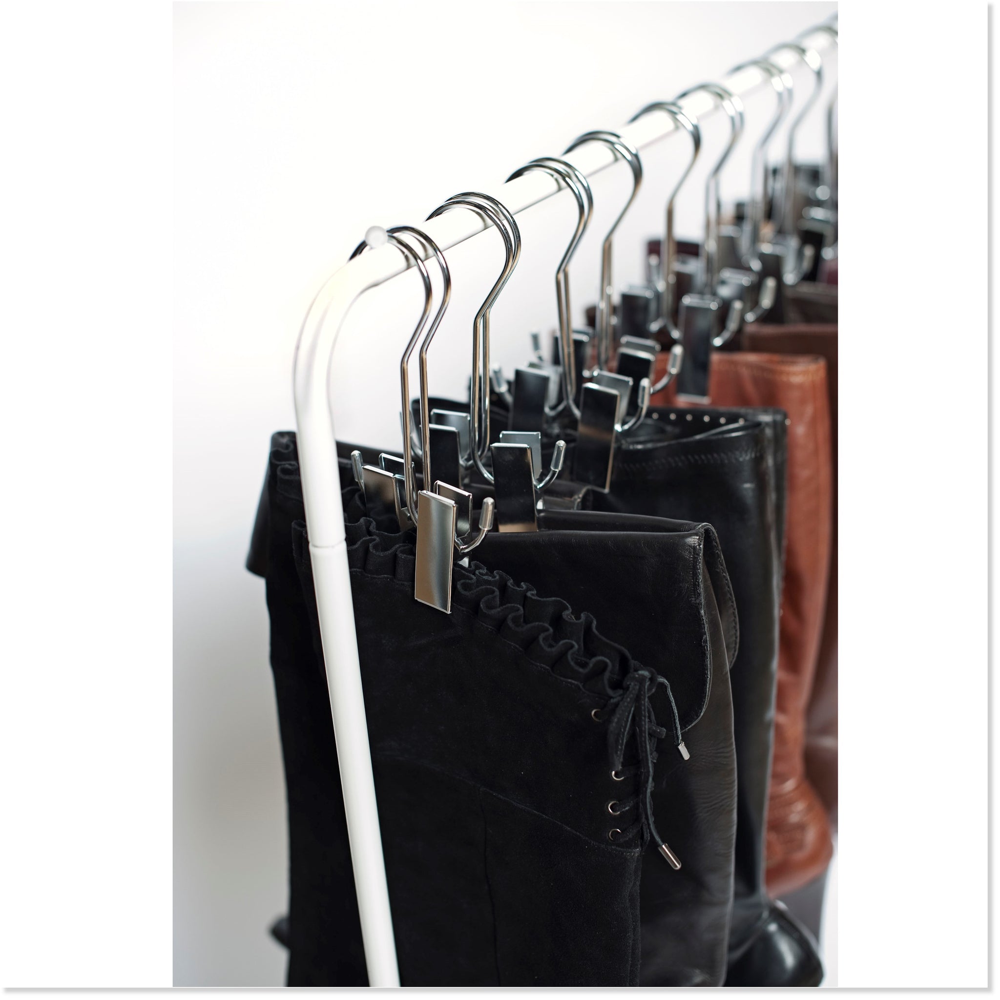 https://boottique.com/cdn/shop/products/Boot_Hanger_Close_up_of_Boot_Rack_with_Boots_Hanging_Square_2048x.jpg?v=1558454571